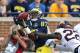 ANN ARBOR, MI - OCTOBER 05: Devin Funchess #87 of the Michigan Wolverines makes the catch for a 46 yard gain over Jeremy Baltzar #22 of the Minnesota Golden Gophers during the fourth quarter of the game at Michigan Stadium on October 5, 2013 in Ann Arbor,