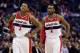 WASHINGTON, DC - MARCH 16: Bradley Beal #3 and and John Wall #2 of the Washington Wizards talk during a free throw in the first half against the Phoenix Suns at Verizon Center on March 16, 2013 in Washington, DC. NOTE TO USER: User expressly acknowledges