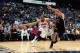 ATLANTA, GA - MARCH 9: Al Horford #15 of the Atlanta Hawks dribbles the ball to the basket against Brook Lopez #11 of the Brooklyn Nets on March 9, 2013 at Philips Arena in Atlanta, Georgia. NOTE TO USER: User expressly acknowledges and agrees that, by
