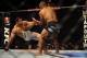 GOLD COAST, AUSTRALIA - DECEMBER 15: Hector Lombard (R) lifts Rousimar Palhares during the Middleweight bout between Hector Lombard and Rousimar Palhares at Gold Coast Convention and Exhibition Centre on December 15, 2012 on the Gold Coast, Australia. (