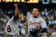 Miguel Cabrera celebrates with Torii Hunter after hitting a two-run home in the fourth inning of Game 5