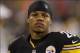 Aug 29, 2013; Charlotte, NC, USA; Pittsburgh Steelers running back Le'Veon Bell (26) stands on the sidelines during the game against the Carolina Panthers at Bank of America Stadium. The Panthers defeated the Steelers 25-10. Mandatory Credit: Jeremy Breva