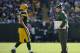 GREEN BAY, WI - OCTOBER 06: Aaron Rodgers #12 of the Green Bay Packers speaks to head coach Mike McCarthy of the Green Bay Packers during the game against the Detroit Lions at Lambeau Field on October 6, 2013 in Green Bay, Wisconsin. (Photo by Harry How