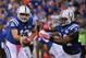 INDIANAPOLIS, IN - OCTOBER 06: Andrew Luck #12 of the Indianapolis Colts hands the ball off to Trent Richardson #34 during a game against the Seattle Seahawks at Lucas Oil Stadium on October 6, 2013 in Indianapolis, Indiana. (Photo by Jonathan Moore/Getty