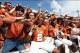 Oct 12, 2013; Dallas, TX, USA; Texas Longhorns receiver Kendall Sanders (2) celebrates with fans after the game against the Oklahoma Sooners during the Red River Rivalry at the Cotton Bowl Stadium. The Texas Longhorns beat the Oklahoma Sooners 36-20. Man