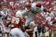Oct 12, 2013; Dallas, TX, USA; Oklahoma Sooners fullback Trey Millard (33) jumps over Texas Longhorns safety Adrian Phillips (17) during the first quarter of the game during the Red River Rivalry at Cotton Bowl Stadium. Mandatory Credit: Tim Heitman-USA T