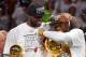 Jun 20, 2013; Miami, FL, USA; Miami Heat small forward LeBron James (left) and shooting guard Dwyane Wade (right) celebrate after defeating the San Antonio Spurs in game seven in the 2013 NBA Finals at American Airlines Arena. Miami Heat won 95-88 to win