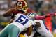 ARLINGTON, TX - OCTOBER 13: Robert Griffin III #10 of the Washington Redskins fumbles the ball while being sacked by Kyle Wilber #51 of the Dallas Cowboys and George Selvie #99 of the Dallas Cowboys in the fourth quarter on October 13, 2013 in Arlingto