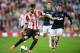 SUNDERLAND, ENGLAND - OCTOBER 05: Ondrej Celustka of Sunderland is closed down by Wayne Rooney of Manchester United during the Barclays Premier League match between Sunderland and Manchester United at the Stadium of Light on October 5, 2013 in Sunderland,