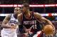 Mar 16, 2013; Philadelphia, PA, USA; Portland Trail Blazers forward LaMarcus Aldridge (12) is defended by Philadelphia 76ers center Lavoy Allen (50) during the third quarter at the Wells Fargo Center. The Sixers defeated the Trail Blazers 101-100. Mandato