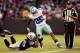 OAKLAND, CA - AUGUST 9: Running back Lance Dunbar #25 of the Dallas Cowboys runs for the outside as he is caught by safety Usama Young #26 of the Oakland Raiders in the second quarter of a preseason game on August 9, 2013 at O.co Coliseum in Oakland, Cal
