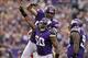 Sep 22, 2013; Minneapolis, MN, USA; Minnesota Vikings linebacker Erin Henderson (50) celebrates a sack with defensive end Jared Allen (69) during the third quarter against the Cleveland Browns at Mall of America Field at H.H.H. Metrodome. The Browns defea