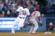 LOS ANGELES, CA - OCTOBER 14: Yasiel Puig #66 of the Los Angeles Dodgers rounds second base as he hits a RBI triple in the fourth inning against the St. Louis Cardinals in Game Three of the National League Championship Series at Dodger Stadium on October