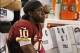 Oct 13, 2013; Arlington, TX, USA; Washington Redskins quarterback Robert Griffin III (10) sits on the bench during the game against the Dallas Cowboys at AT&T Stadium. The Dallas Cowboys beat the Washington Redskins 31-16. Mandatory Credit: Tim Heitman-US