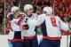 CHICAGO, IL - OCTOBER 01: (L-R) Mikhail Grabovski #84 of the Washington Capitals celebrates with teammates Nicklas Backstrom #19 and Alex Ovechkin #8 after scoring against the Chicago Blackhawks in the third period during the NHL game on October 1, 2013 a