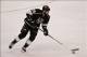 Jun 4, 2013; Los Angeles, CA, USA; Los Angeles Kings left wing Dustin Penner (25) moves the puck down the ice against Chicago in game three of the Western Conference finals of the 2013 Stanley Cup Playoffs at the Staples Center. Mandatory Credit: Robert