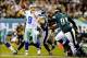 November 11, 2012; Philadelphia, PA, USA; Dallas Cowboys quarterback Tony Romo (9) passes in front of Philadelphia Eagles defensive tackle Fletcher Cox (91) during the second quarter at Lincoln Financial Field. Mandatory Credit: Dale Zanine-USA TODAY Spor