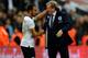 LONDON, ENGLAND - OCTOBER 15: England manager Roy Hodgson shakes hands with Andros Townsend of England as they qualify for the World Cup in Brazil after the FIFA 2014 World Cup Qualifying Group H match between England and Poland at Wembley Stadium on Oct