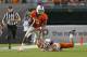 MIAMI GARDENS, FL - SEPTEMBER 21: Stacy Coley #3 of the Miami Hurricanes eludes the tackle of Warren Sweet #46 of the Savannah State Tigers as he runs with the ball on September 21, 2013 at Sun Life Stadium in Miami Gardens, Florida. Miami defeated Savann