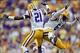 Oct 12, 2013; Baton Rouge, LA, USA; LSU Tigers defensive back Rashard Robinson (21) and safety Craig Loston (6) celebrate after a turnover against the Florida Gators during the fourth quarter of a game at Tiger Stadium. LSU defeated Florida 17-6. Mandator
