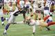 MINNEAPOLIS, MN - SEPTEMBER 23: Percy Harvin #12 of the Minnesota Vikings avoids a tackle by Chris Culliver #29 of the San Francisco 49ers during the fourth quarter of their game on September 23, 2012 at Mall of America Field at the Hubert H. Humphrey Met