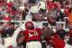 SALT LAKE CITY, UT - OCTOBER 12: Tyler Gaffney #25 of the Stanford Cardinal jumps over LT Tuipulotu #58 and Davion Orphey #33 of the Utah Utes to score a touchdown during the first half of an NCAA football game October 12, 2013 at Rice Eccles Stadium in S