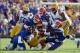 Oct 12, 2013; Baton Rouge, LA, USA; LSU Tigers running back Jeremy Hill (33) is tackled by a multiple Florida Gators defenders during the first quarter of their game at Tiger Stadium. Mandatory Credit: Chuck Cook-USA TODAY Sports