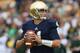 SOUTH BEND, IN - SEPTEMBER 21: Tommy Rees #11 of the Notre Dame Fighting Irish looks for a receiver against the Michigan State Spartans at Notre Dame Stadium on September 21, 2013 in South Bend, Indiana. Notre dame defeated Michigan State 17-13. (Photo