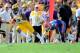 BATON ROUGE, LA - OCTOBER 12: Odell Beckham Jr. #3 of the LSU Tigers catches a pass in front of Loucheiz Purifoy #15 of the Florida Gators during a game at Tiger Stadium on October 12, 2013 in Baton Rouge, Louisiana. LSU won the game 17-6. (Photo by St