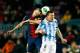 BARCELONA, SPAIN - JANUARY 16: Andres Iniesta (L) of Barcelona FC saves on a header with Ignacio Camacho (R) of Malaga CF during the Copa del Rey Quarter Final match between Barcelona FC and Malaga CF at Camp Nou on January 16, 2013 in Barcelona, Spain. (
