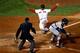 BOSTON, MA - OCTOBER 19: Xander Bogaerts #72 of the Boston Red Sox scores a run off of Jacoby Ellsbury #2 single to right against Max Scherzer #37 of the Detroit Tigers in the fifth inning during Game Six of the American League Championship Series at Fen