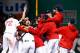 BOSTON, MA - OCTOBER 19: Junichi Tazawa #36 of the Boston Red Sox celebrates with his teammates after defeating the Detroit Tigers in Game Six of the American League Championship Series at Fenway Park on October 19, 2013 in Boston, Massachusetts. The Red