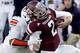HOUSTON, TX - OCTOBER 19: Johnny Manziel #2 of the Texas A&M Aggies is tackled by Kris Frost #17 of the Auburn Tigers on October 19, 2013 at Kyle Field in College Station, Texas. Auburn Tigers won 45 to 41.(Photo by Thomas B. Shea/Getty Images)
