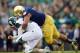 Sep 21, 2013; South Bend, IN, USA; Notre Dame Fighting Irish defensive end Stephon Tuitt (7) sacks Michigan State Spartans quarterback Connor Cook (18) in the fourth quarter at Notre Dame Stadium. Notre Dame won 17-13. Mandatory Credit: Matt Cashore-USA T