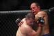 Oct 19, 2013; Houston, TX, USA; Cain Velasquez (red gloves) fights against Junior Dos Santos (blue gloves) in the world heavyweight championship bout during UFC 166 at Toyota Center. Mandatory Credit: Andrew Richardson-USA TODAY Sports