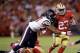 SAN FRANCISCO, CA - OCTOBER 06: LaMichael James #23 of the San Francisco 49ers is tackled by Sam Montgomery #57 of the Houston Texans at Candlestick Park on October 6, 2013 in San Francisco, California. (Photo by Ezra Shaw/Getty Images)