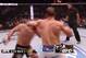 Dos Santos attempts a slapping left hook as Velasquez comes forward.