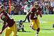 Oct 20, 2013; Landover, MD, USA; Washington Redskins quarterback Robert Griffin III (10) runs with the ball against the Chicago Bears during the first half at FedEX Field. Mandatory Credit: Brad Mills-USA TODAY Sports