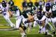 Dec. 29, 2012; Tempe, AZ, USA; TCU Horned Frogs defensive tackle Chucky Hunter (96) is blocked by Michigan State Spartans guard Blake Treadwell (64) as quarterback Andrew Maxwell (10) runs with the ball during the first half during the Buffalo Wild Wings