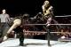 Reigns get a close-up view of Goldust's boot. (Photo: WWE)