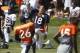 Aug 12, 2013; Englewood, CO, USA; Denver Broncos quarterback Peyton Manning (18) warms up during training camp at the Broncos training facility. Mandatory Credit: Chris Humphreys-USA TODAY Sports