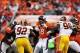 Oct 27, 2013; Denver, CO, USA; Denver Broncos quarterback Peyton Manning (18) is hit by Washington Redskins linebacker Brian Orakpo (98) as he throws a pass during the second half at Sports Authority Field at Mile High. The Broncos won 45-21. Mandatory Cr