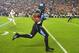 Oct 17, 2013; Chapel Hill, NC, USA; North Carolina Tar Heels tight end Eric Ebron (85) runs for a touchdown as Miami Hurricanes defensive back Antonio Crawford (21) defends in the first quarter at Kenan Memorial Stadium. Mandatory Credit: Bob Donnan-USA T