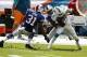 Oct 20, 2013; Miami Gardens, FL, USA; Miami Dolphins wide receiver Mike Wallace (11) is tackled by Buffalo Bills free safety Jairus Byrd (31) and cornerback Stephon Gilmore (24) in the second quarter of a game at Sun Life Stadium. Mandatory Credit: Robert