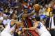 Oct 30, 2013; Philadelphia, PA, USA; Miami Heat forward LeBron James (6) is double teamed by Philadelphia 76ers guard Evan Turner (12) and guard Michael Carter-Williams (1) during the first quarter at Wells Fargo Center. Mandatory Credit: Howard Smith-USA
