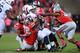 COLUMBUS, OH - OCTOBER 26: The Ohio State Buckeyes defense gangs up to tackle Zach Zwinak #28 of the Penn State Nittany Lions in the third quarter at Ohio Stadium on October 26, 2013 in Columbus, Ohio. Ohio State defeated Penn State 63-14. (Photo by Jam
