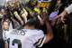 MINNEAPOLIS, MN - OCTOBER 27: Aaron Rodgers #12 of the Green Bay Packers celebrates a win of the game against the Minnesota Vikings with fans while leaving the field on October 27, 2013 at Mall of America Field at the Hubert H. Humphrey Metrodome in Minne