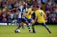 WEST BROMWICH, ENGLAND - OCTOBER 06: Nicolas Anelka of West Bromwich Albion battles with Mathieu Flamini (C) and Aaron Ramsey of Arsenal (R) during the Barclays Premier League match between West Bromwich Albion and Arsenal at The Hawthorns on October 6,