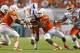 MIAMI GARDENS, FL - SEPTEMBER 21: Al-Quadin Muhammad #98 of the Miami Hurricanes sacks Antonio Bostick #13 of the Savannah State Tigers on September 21, 2013 at Sun Life Stadium in Miami Gardens, Florida. (Photo by Joel Auerbach/Getty Images)