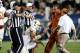 PROVO, UT - SEPTEMBER 7: Quarterback David Ash #14 of the Texas Longhorns is assisted by trainers after he was hurt on a play against the BYU Cougars during the second half of an NCAA football game September 7, 2013 at LaVell Edwards Stadium in Provo, Uta